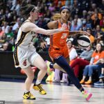 Caitlin Clark is brutally mocked by DiJonai Carrington for flopping after foul… but Sun fans turn on their own star as home crowd BOO her for the taunting gesture