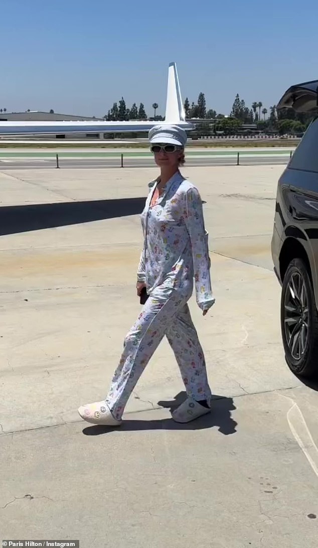 The socialite was spotted boarding the luxury plane in a light blue pyjama set and cozy slippers