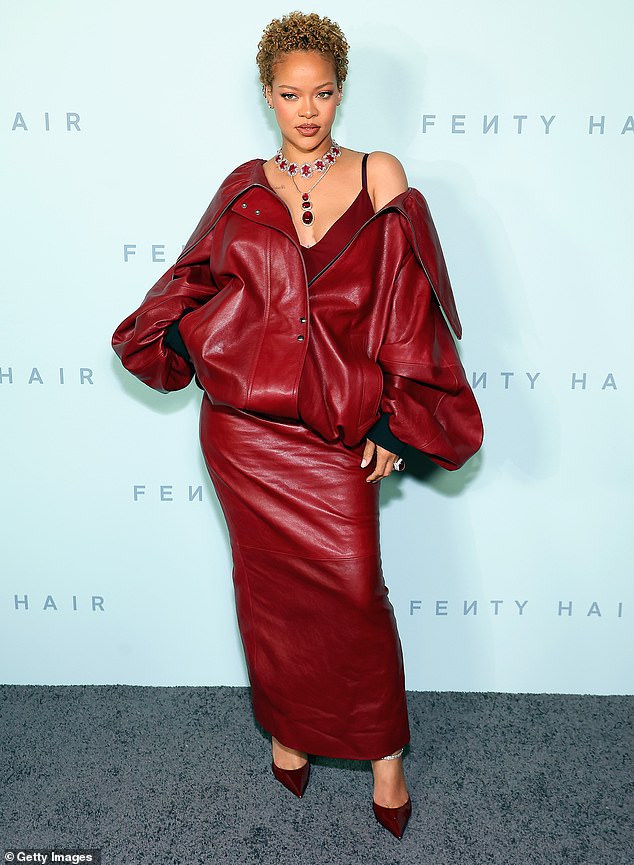 Rihanna shows off her natural locks as she makes a radiant appearance at the launch of her new Fenty Hair line in LA