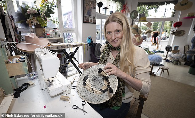 Jess alters the ivory and black 'Suki' hat in her London studio