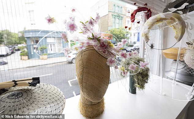 The show-stopping pink blossom 'Hulaniki' hat is available to hire from £300