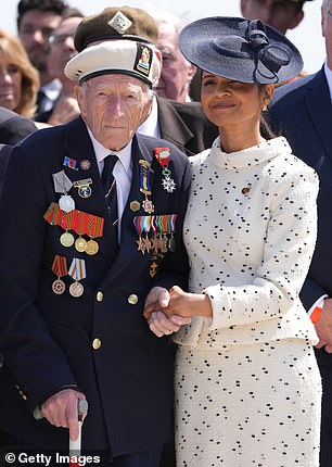 Akshata Murty paired her 'Cavendish' hat with a skirt suit for the D-Day service in Ver-sur-Mer