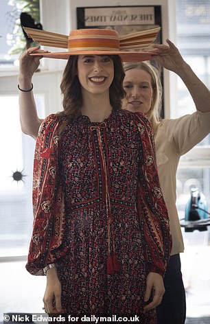 Rebekah tries on the 'Downton' hat that Sarah Ferguson to the wedding of Princess Eugenie and Jack Brooksbank in 2018