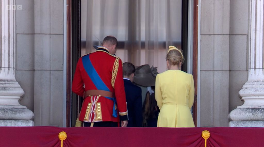 Prince William and Duchess Sophie stand with their backs to the camera