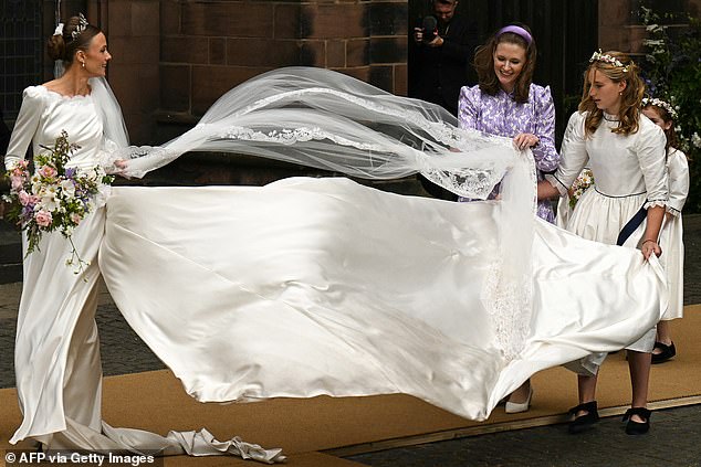 When the Duchess of Westminster had to hold on to her veil during a strong blast of wind and all the other times the Royal family have had to battle with the breeze – as these pictures show…