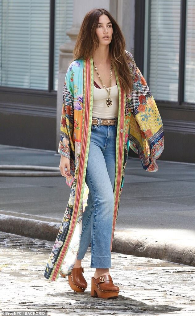 Lily Aldridge is boho chic in 1970s-inspired look with a colorful robe and tight denim jeans during Manhattan photoshoot