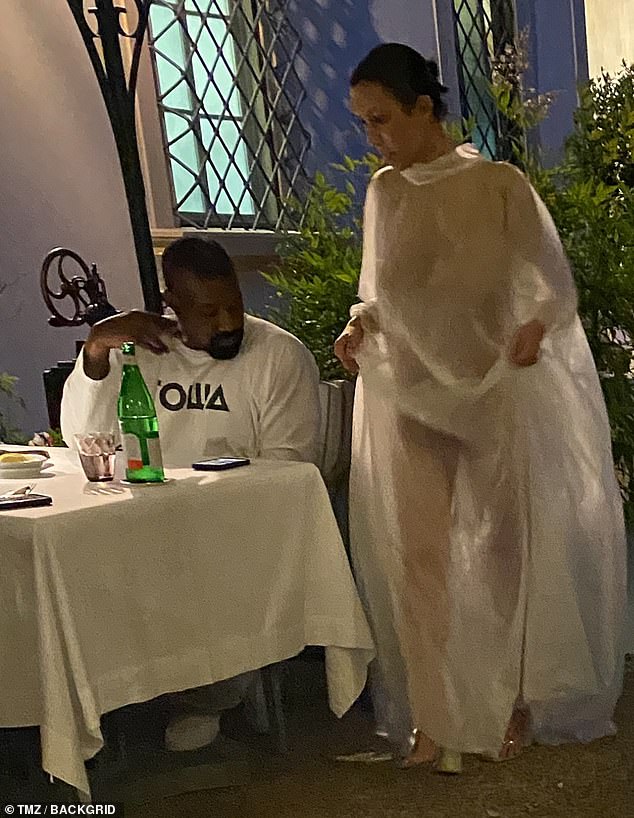 Kanye West’s wife Bianca Censori bares it all as she wears sheer cloak dress WITHOUT underwear during dinner date with rapper in Italy