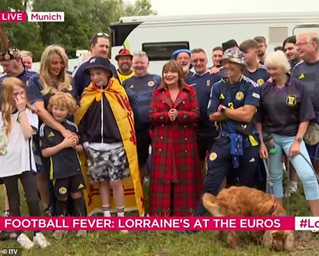 Joining other football supporters, Lorraine said: 'The atmosphere is really great, but they've run out of beer in Germany!'