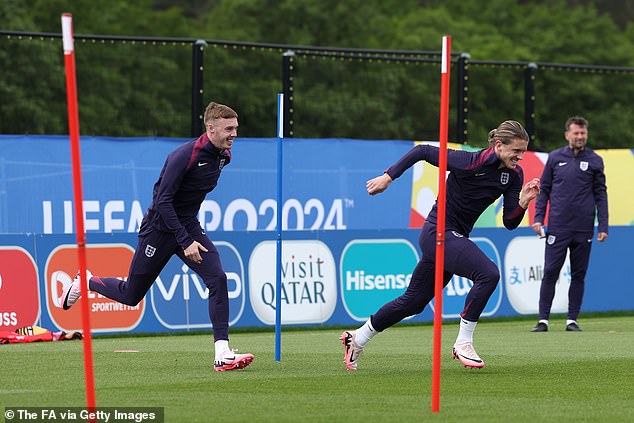 Chelsea players Cole Palmer (left) and Conor Gallagher (right) involved in a sprint drill