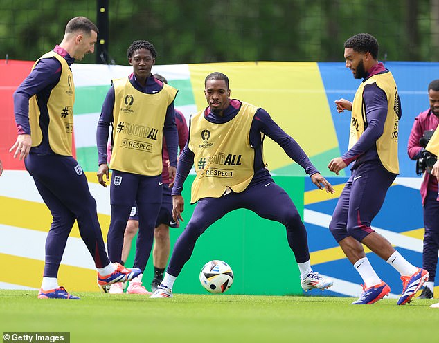 Man United midfielder Koby Manu (second from left) watches intently as Toney attempts to win the ball back