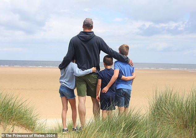 In the Father's Day photo, the trio were on a beach walk with their dad, posing with their backs to the camera and looking out at the ocean.