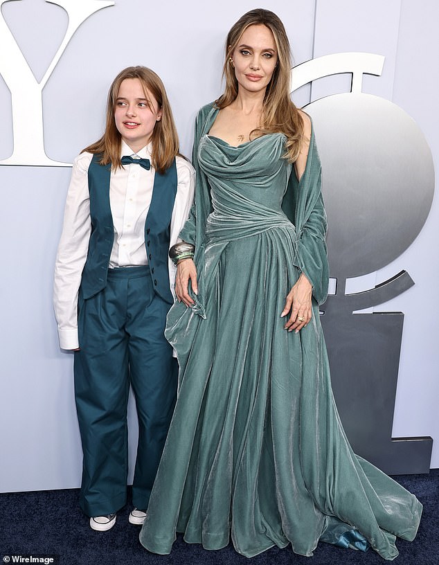 Vivienne - who notably dropped her father Brad Pitt's surname on her Playbill credit - color-coordinated with her mother in teal-colored trousers as well as a matching vest that was left unbuttoned the front