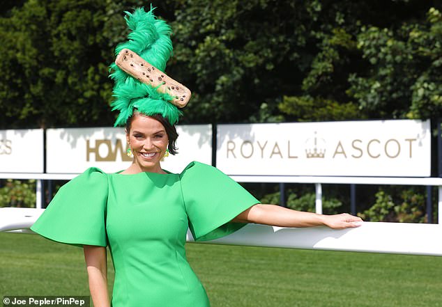 Vicky paired her statement feather hat with a puff-sleeve green midi dress