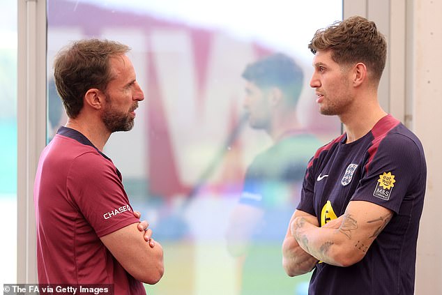 England coach Gareth Southgate was seen talking to defender Stones in the gym