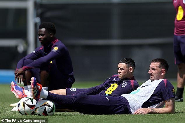 Bukayo Saka, Phil Foden and Lewis Dunk keep an eye out during England's training session