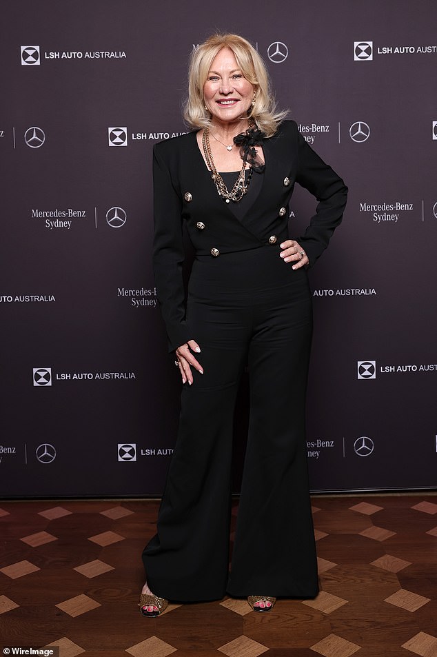 Meanwhile, TV icon Kerri-Anne, 70, looked effortlessly chic in a form-fitting Balmain black jumpsuit
