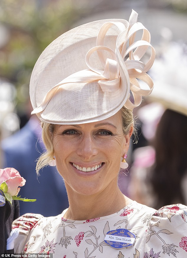 It's all about the accessories! The King's niece paired her elegant dress with a matching cream hat and a pair of stylish earrings