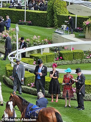 Princess Anne inspecting horses in the parade ring