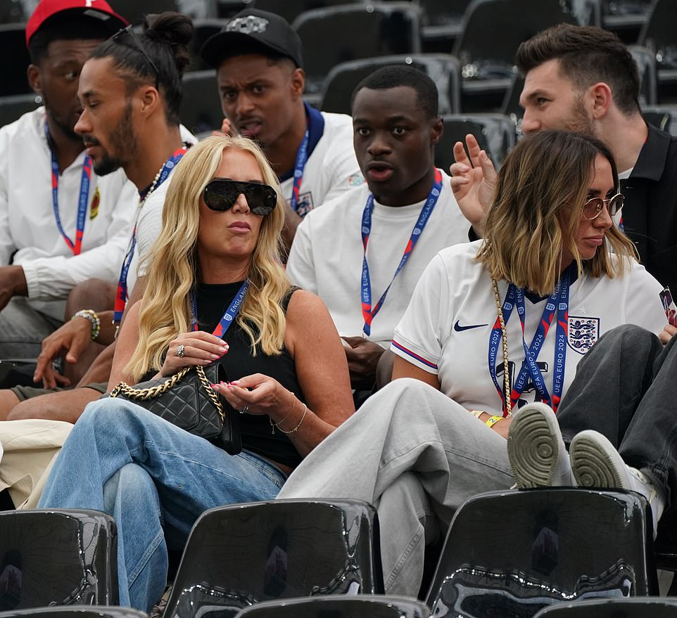 Lewis Dunk's girlfriend Abi Yaxley (left) waits for the Three Lions game against Denmark to begin on Thursday