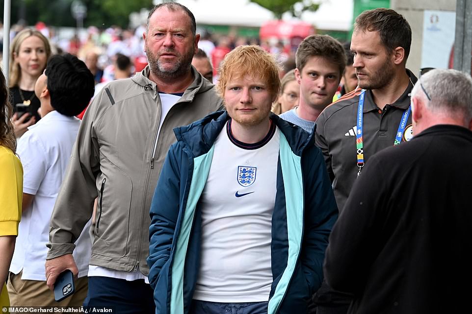 Ed Sheeran is seen arriving in Frankfurt on Thursday where he joined thousands of England fans on the edge of their seats
