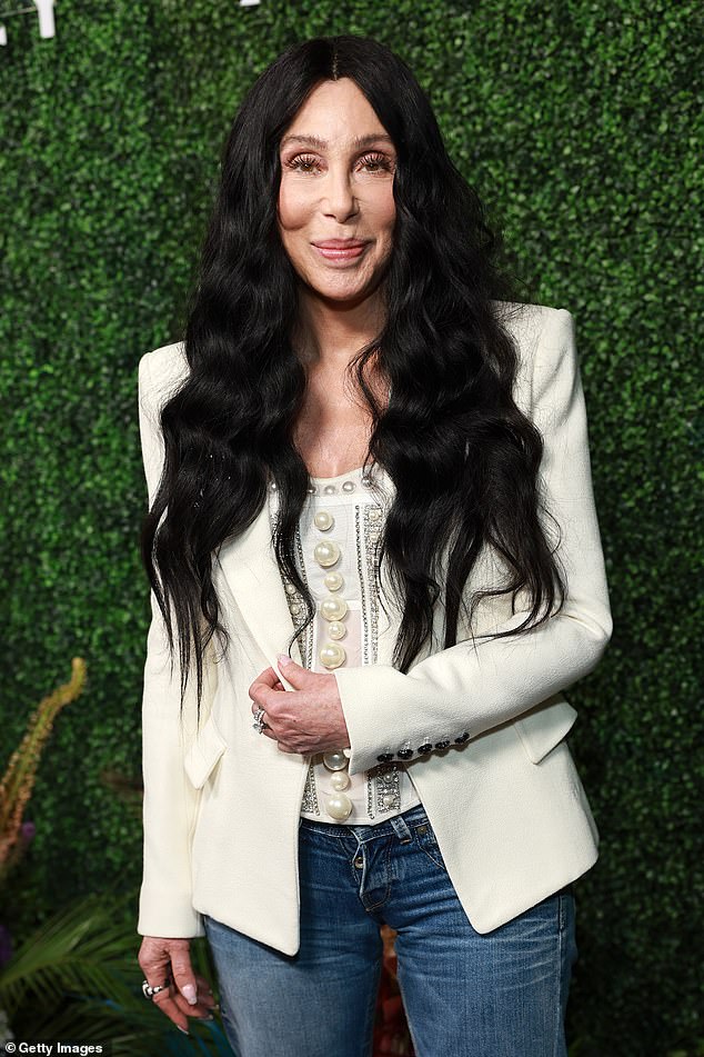 Cher, 78, shows off ageless visage as she attends starry bash in West Hollywood… without toyboy Alexander Edwards, 38