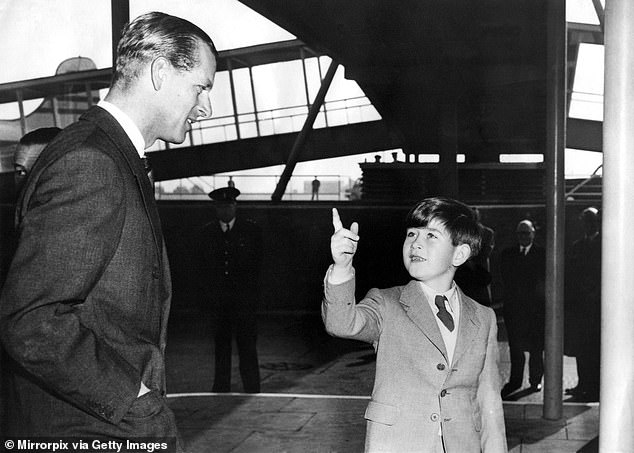 Prince Philip seen with his son Prince Charles preparing to leave for a Commonwealth tour in 1956