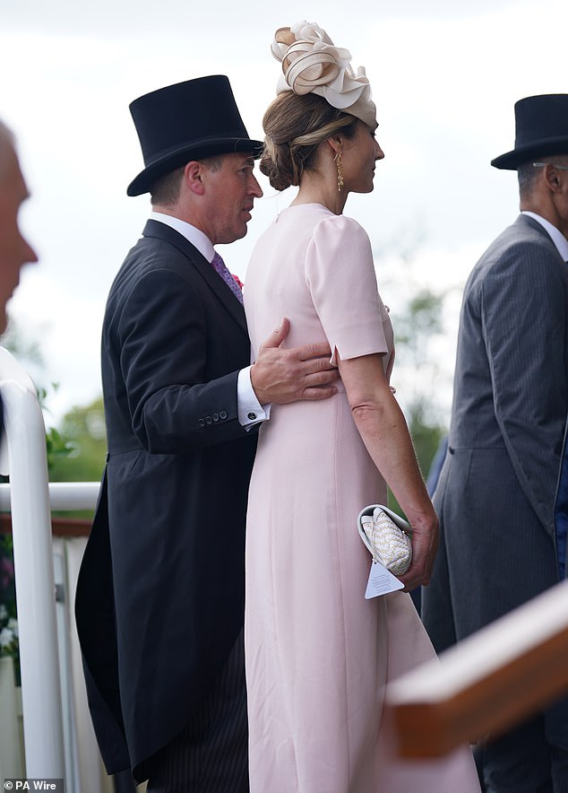 The couple couldn't get enough of  one another with gentle touches all throughout the day at Royal Ascot
