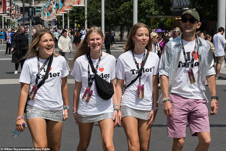 Four fans proudly wearing 'I love Taylor' T-shirts make their way to the concert