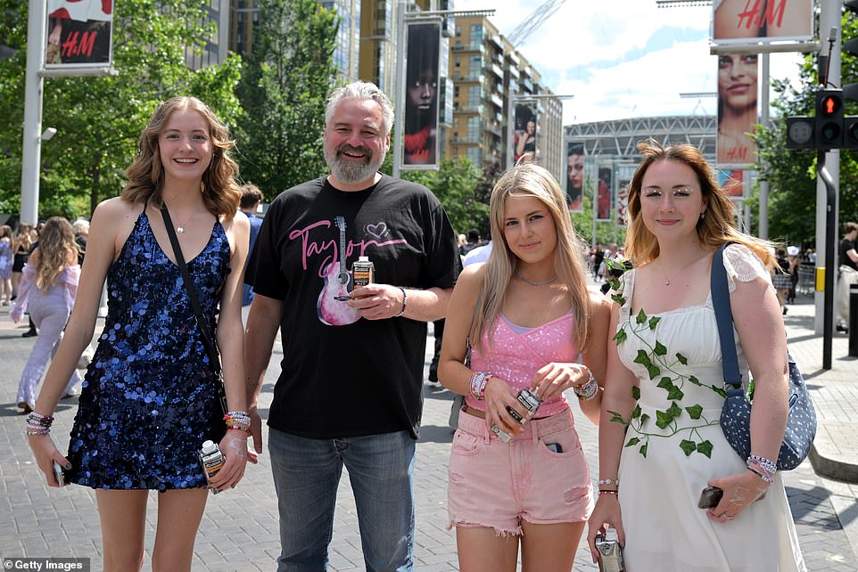 A cheery group of four on their way to sing with Taylor during her set lasting three and a half hours