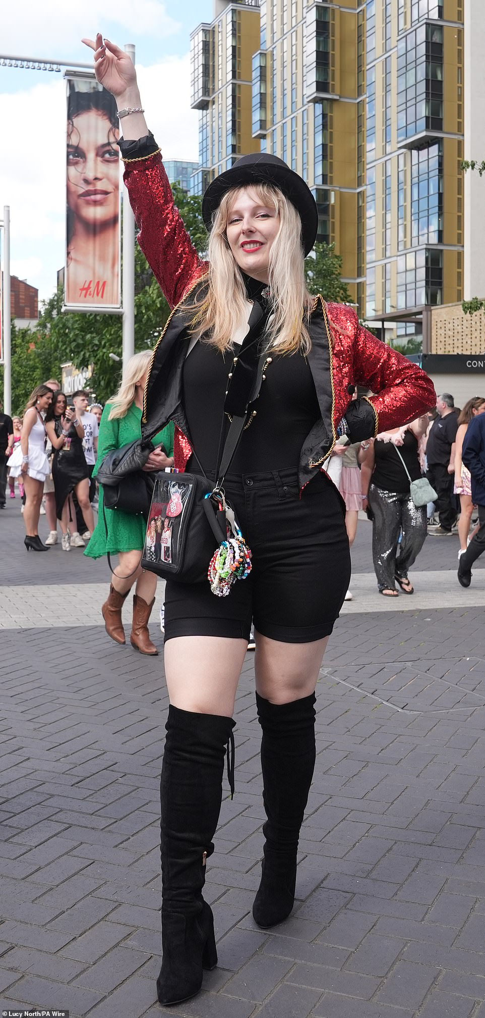 A fan recreates the ringmaster outfit Swift wore at the 2012 MTV Europe Music Awards. She also has friendship bracelets tied to her waist to hand out at the concert