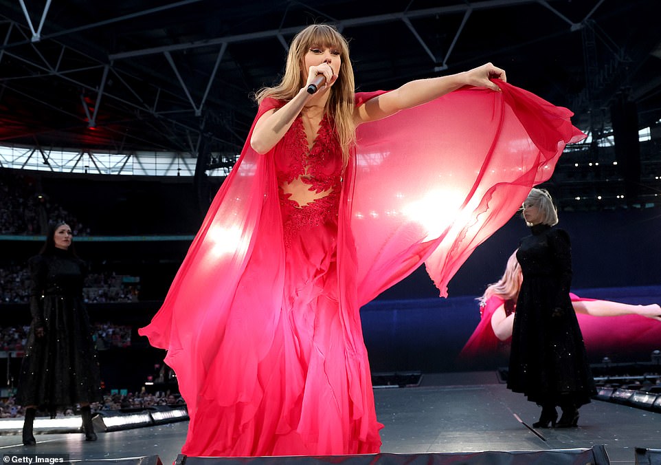 Taylor waves her red cape at Wembley while performing her three-hour long set list