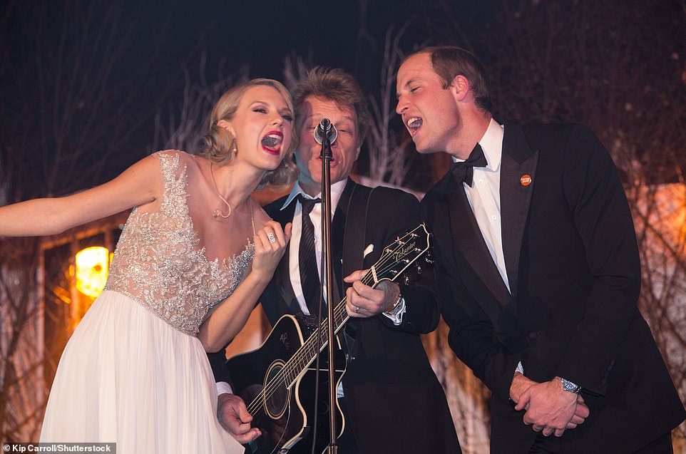 Prince William, who was also at last night's show with this three children, previously performed on stage with Taylor Swift and Jon Bon Jovi at a charity gig in 2013 - the trio are seen here performing Bon Jovi's hit Livin' On A Prayer