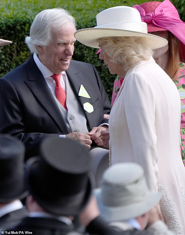 The US actor and director (pictured, left) appeared delighted to meet Queen Camilla (pictured, right) today
