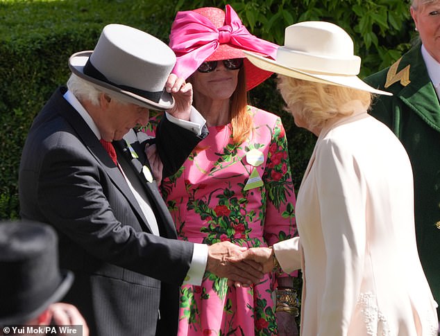 The American actor and director was seen taking off his hat while shaking hands with Queen Camilla