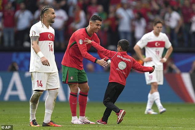 A young fan at the Euro 2024 competition dodged security personnel and ran towards Ronaldo, who stopped to hug the child