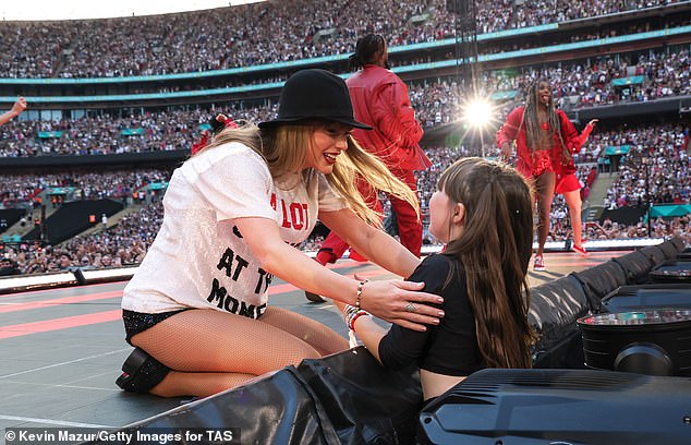 Swift was seen talking to a young girl in the audience as she performed the Red Era of her show at Wembley stadium on Saturday