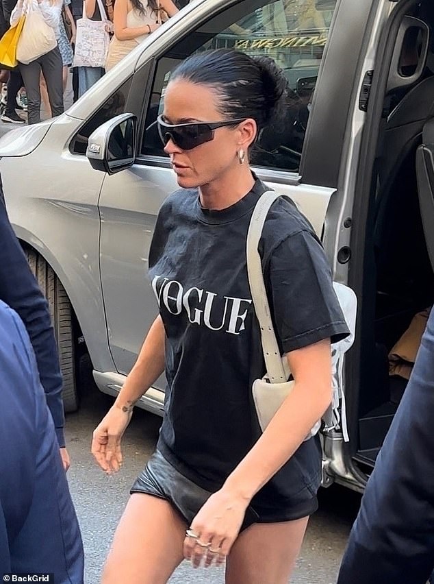 The 39-year-old artist wore black leather shorts while arriving at the luxury hotel. The Roar singer wore black motorcycle boots and carried a grey shoulder bag