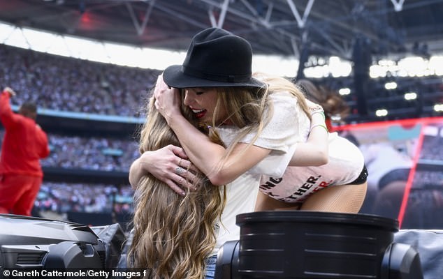 Taylor hugs a fan during the song 22 at The Eras Tour on Sunday night