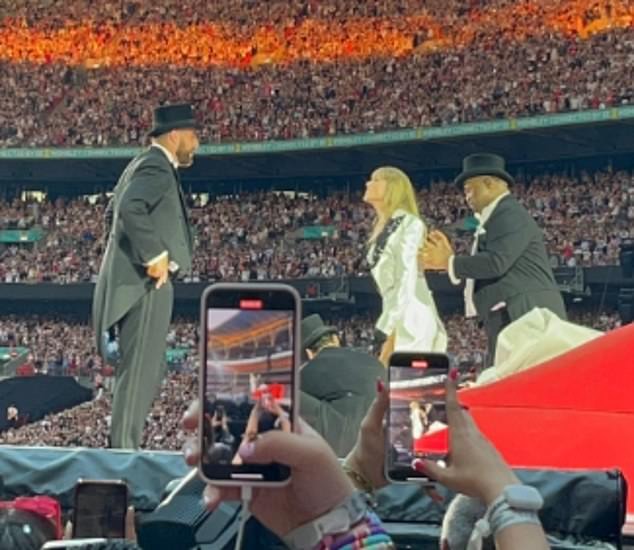 Tonight Travis Kelce (left) joined Taylor onstage during the song I Can Do It With a Broken Heart