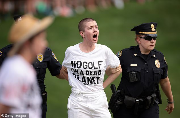Climate change protestors disrupt Travelers Championship after storming 18th green before crucial Scottie Scheffler putt