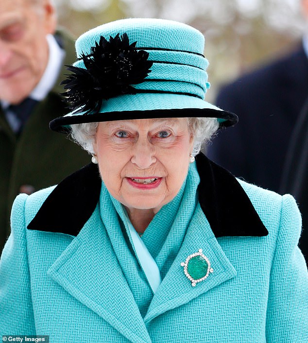 Queen Elizabeth II wearing the Delhi carved emerald brooch, which formerly belonged to Queen Mary, during a church service at the Church of St Lawrence near the Sandringham Estate in 2013.