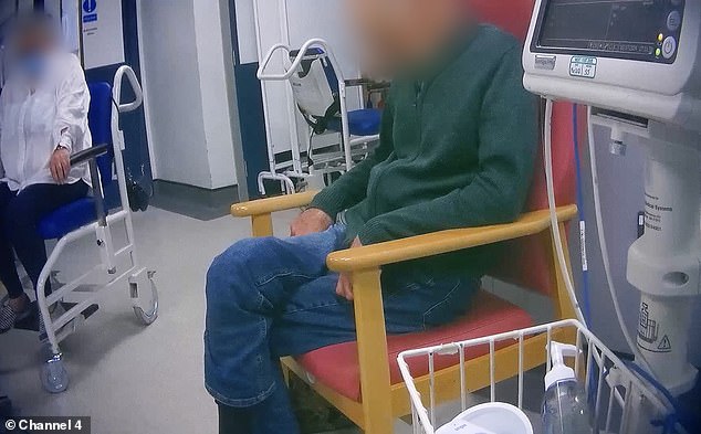 A patient sits in a chair waiting for care as the NHS care crisis continues