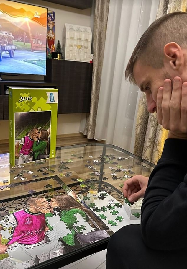 Varga is seen completing a puzzle while celebrating on the pitch with Laura
