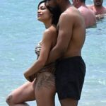 Rosario Dawson, 45, debuts major new tattoos on her thighs and legs on a romantic getaway with her boyfriend Adama Sanneh at the beach in Sardinia
