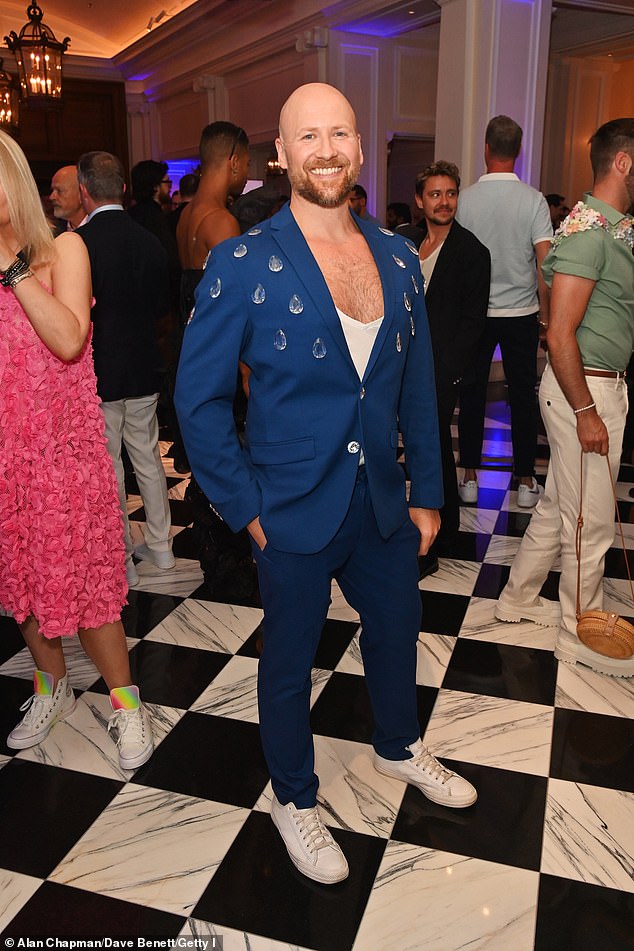 While Thomas Wolski showed off plenty of his chest in a plunging V-neck under a navy blue suit, encrusted in large crystals