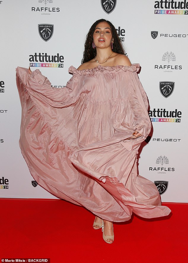 Mabel playfully threw up her skirt as she posed up a storm on the red carpet, exposing her nude peep-toe heels