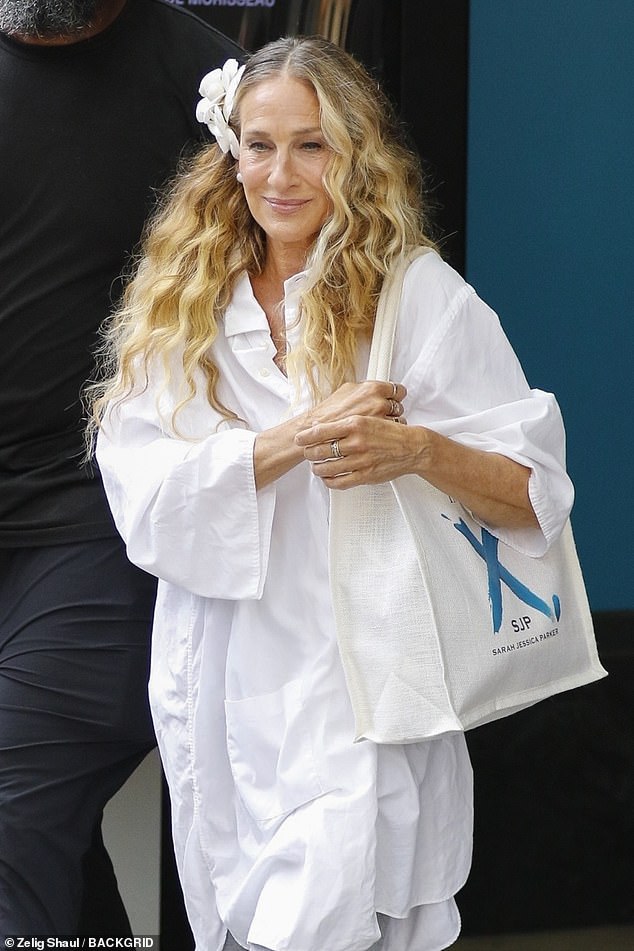 The six-time Golden Globe winner, who previously confessed she has kept every piece of her character Carrie Bradshaw's wardrobe over the past two decades, looked in high spirits after a long day of work when she wore an oversized white dress shirt