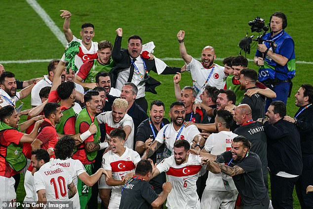As the tension subsided, the Turkish team celebrated reaching the last 16, where they will face Austria