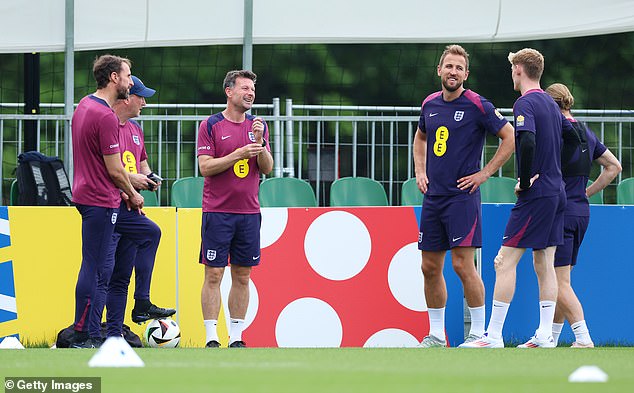 The team was seen smiling and chatting during the session ahead of their knockout tie against Slovakia on Sunday.