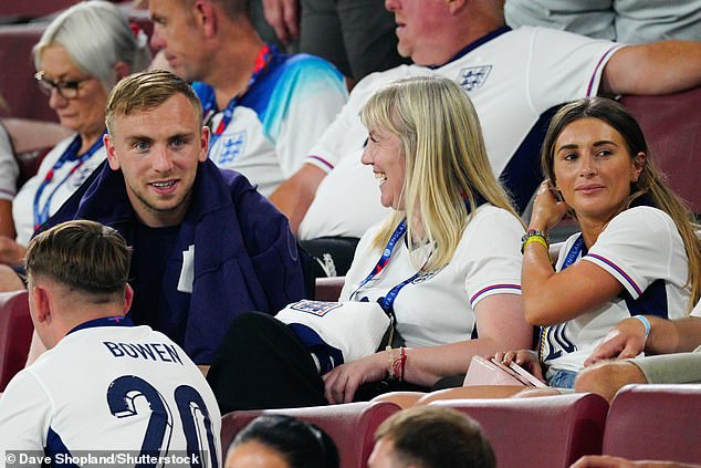 Jarrod Bowen (pictured left) sits with his family and teammate Danny Dyer (right) after the game